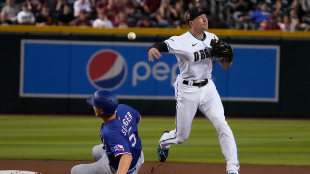 Aug 21, 2023; Phoenix, Arizona, USA; Arizona Diamondbacks shortstop Nick Ahmed (13) gets the force out on Texas Rangers shortstop Corey Seager (5) during the first inning at Chase Field. Mandatory Credit: Rick Scuteri-USA TODAY Sports